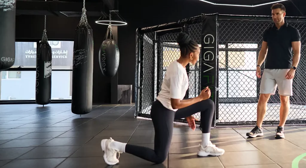 Personal trainer in Dubai coaching a client during a private training session