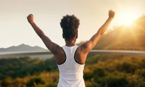 Woman staying consistent with fitness through personal training, strength training and a realistic workout system