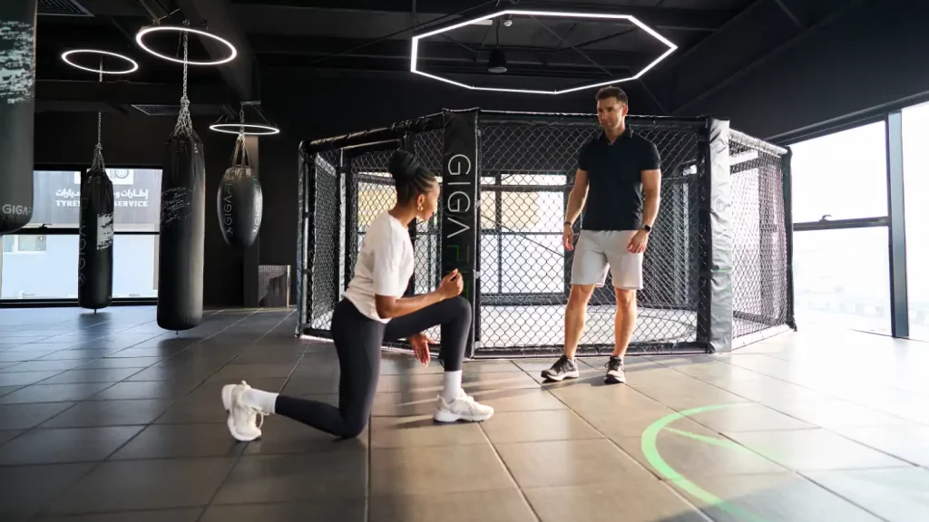 Rozzie Kinyua coaching a client during a private personal training session in Dubai